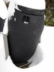 Snow shadow under compost tumbler