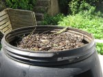 Compost tumbler brimming full